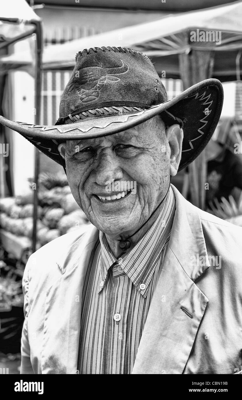 Portrait of smiling local man in Central Market with fruits and vegetables in Pavas section of San Jose in Costa Rica Stock Photo