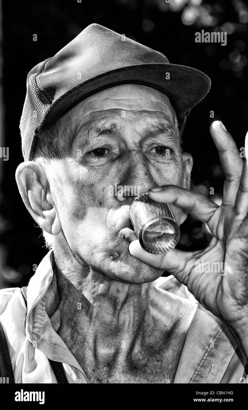 Portrait closeup of old man drinking in center park of Cienfuegos Cuba Stock Photo