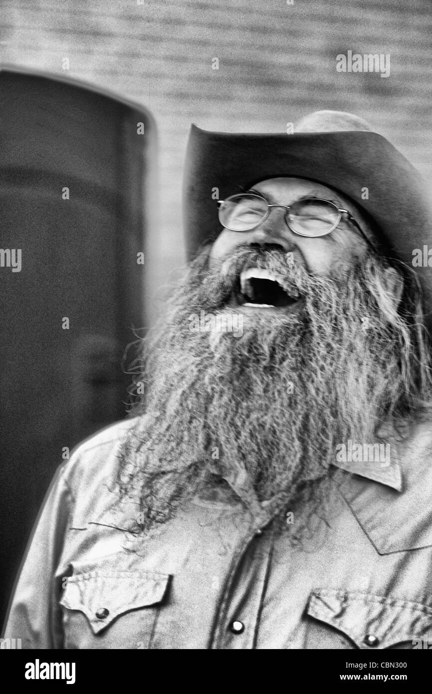 Abstract portrait of laughing cowboy with gray beard in Billings Montana Stock Photo