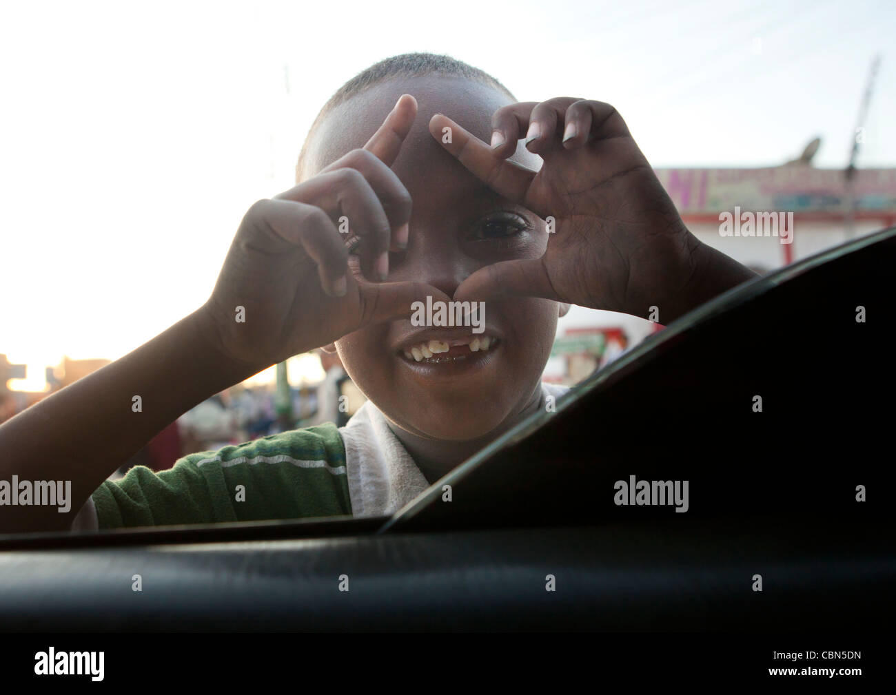Young Boy Imitating Take Photo From Car, Hargeisa Somaliland Stock Photo