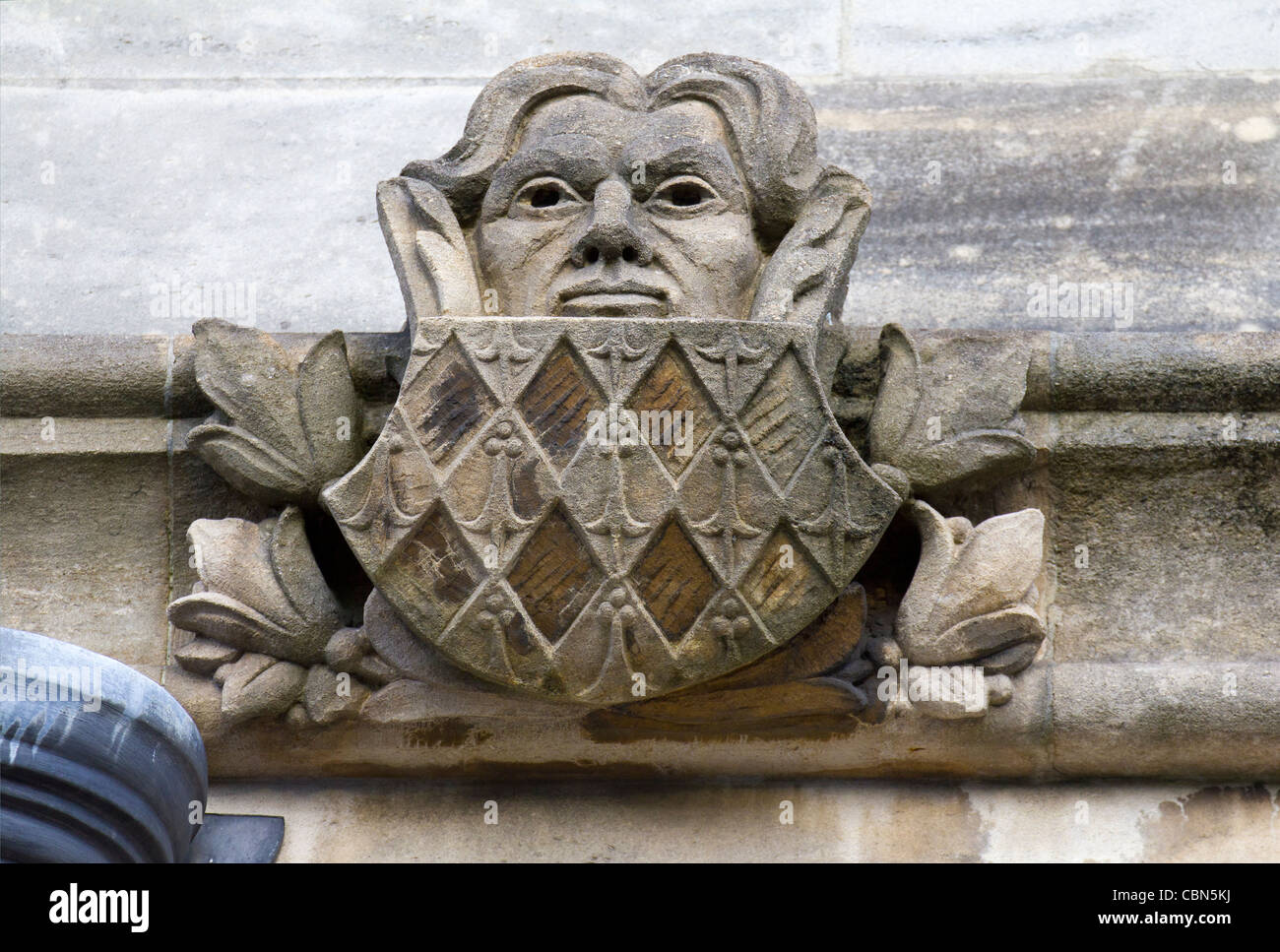 Gargoyles and Exotics of Magdalen College, Oxford - man and shield Stock Photo