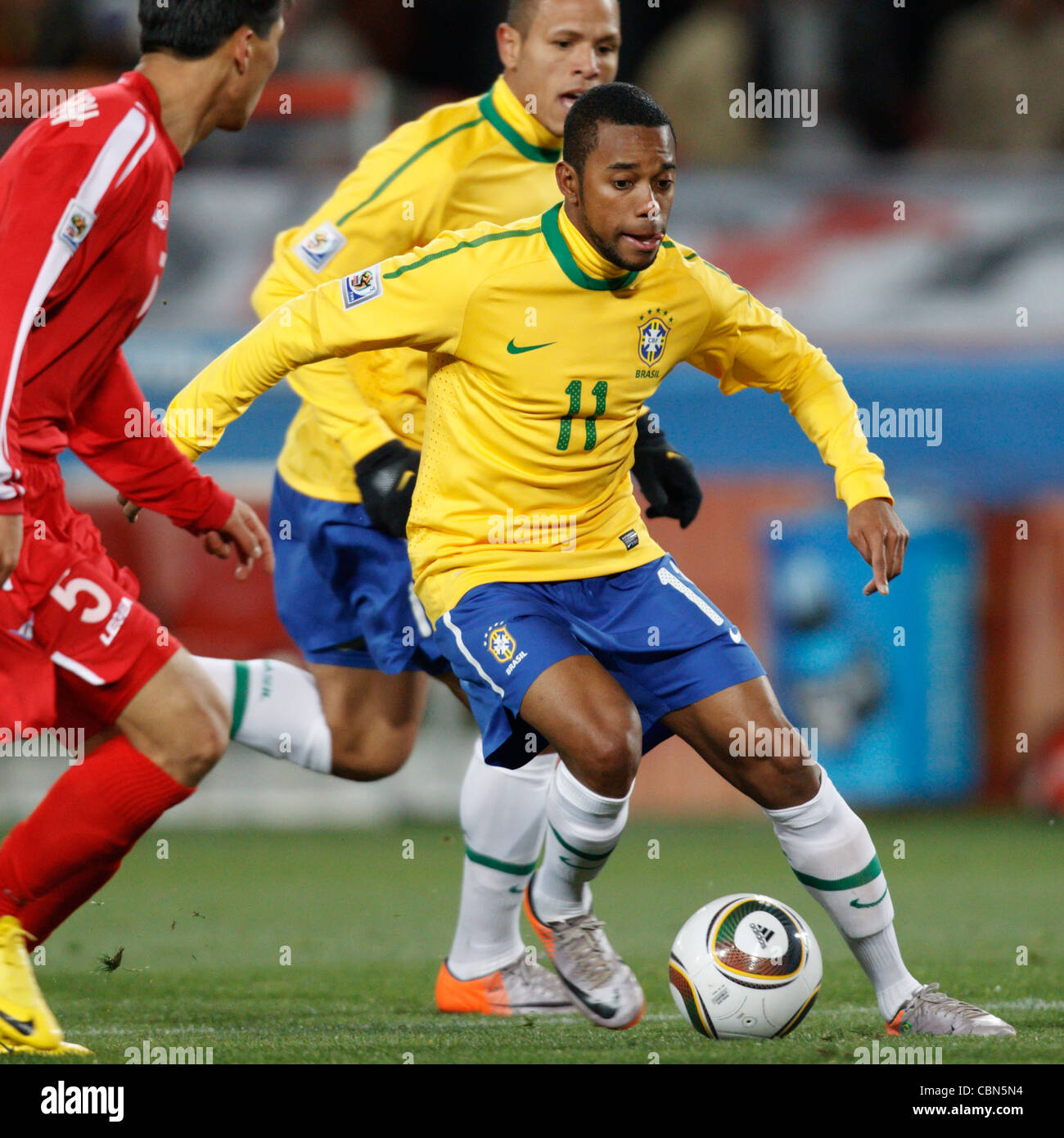 Robinho of Brazil on the attack against North Korea during a FIFA World Cup match at Ellis Park Stadium on June 15, 2010. Stock Photo