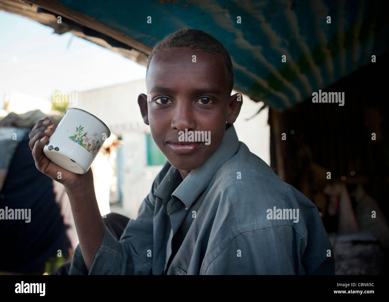 Young Boy Holding Mug In Boorama Somaliland Stock Photo