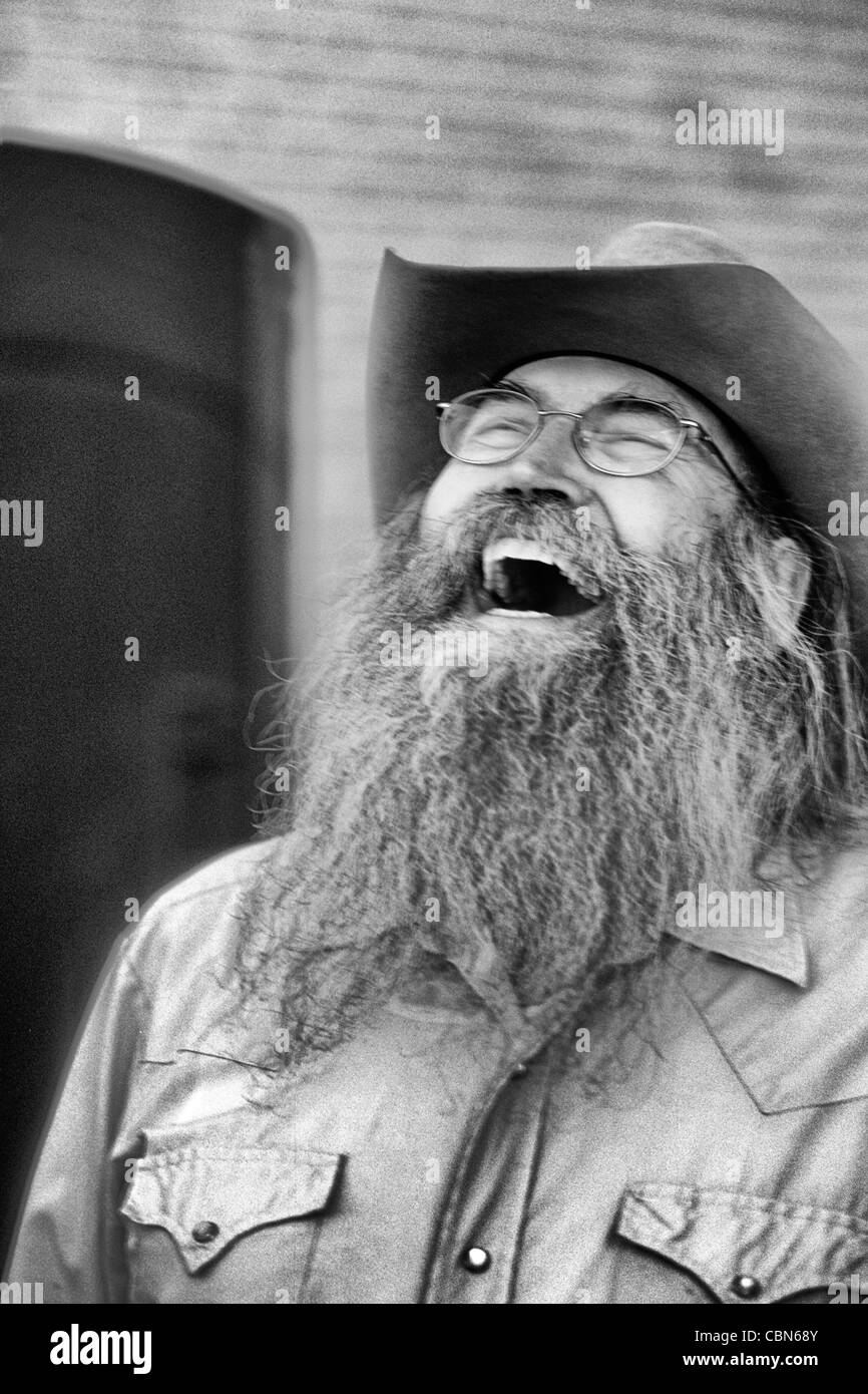 Abstract portrait of laughing cowboy with gray beard in Billings Montana  Stock Photo