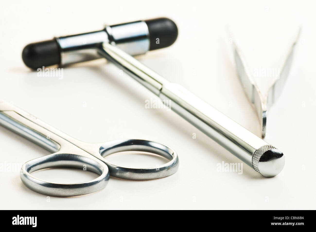 reflex hammer scissors and forceps Stock Photo Alamy