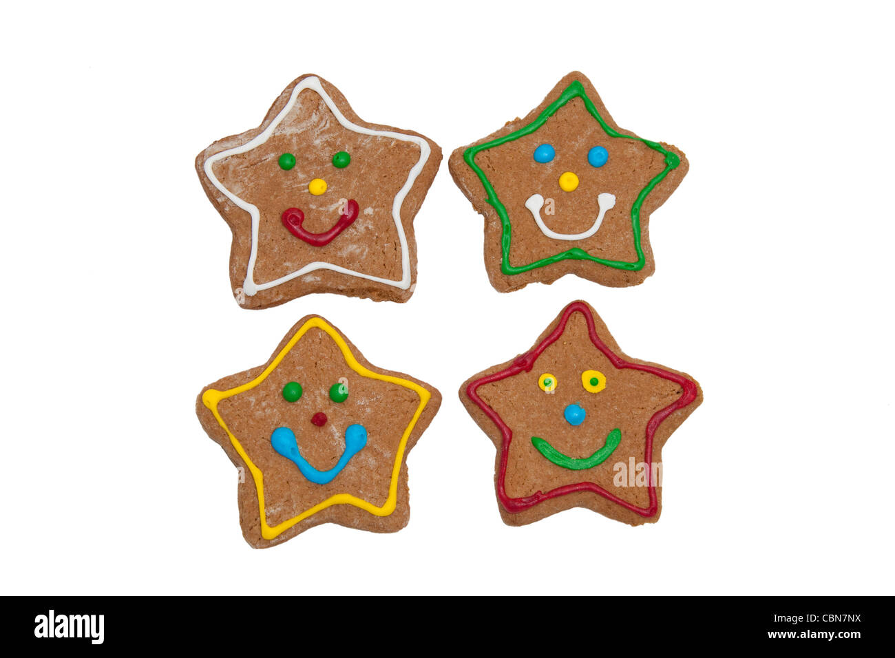 Smiling star shaped Christmas gingerbread cookies on white background Stock Photo