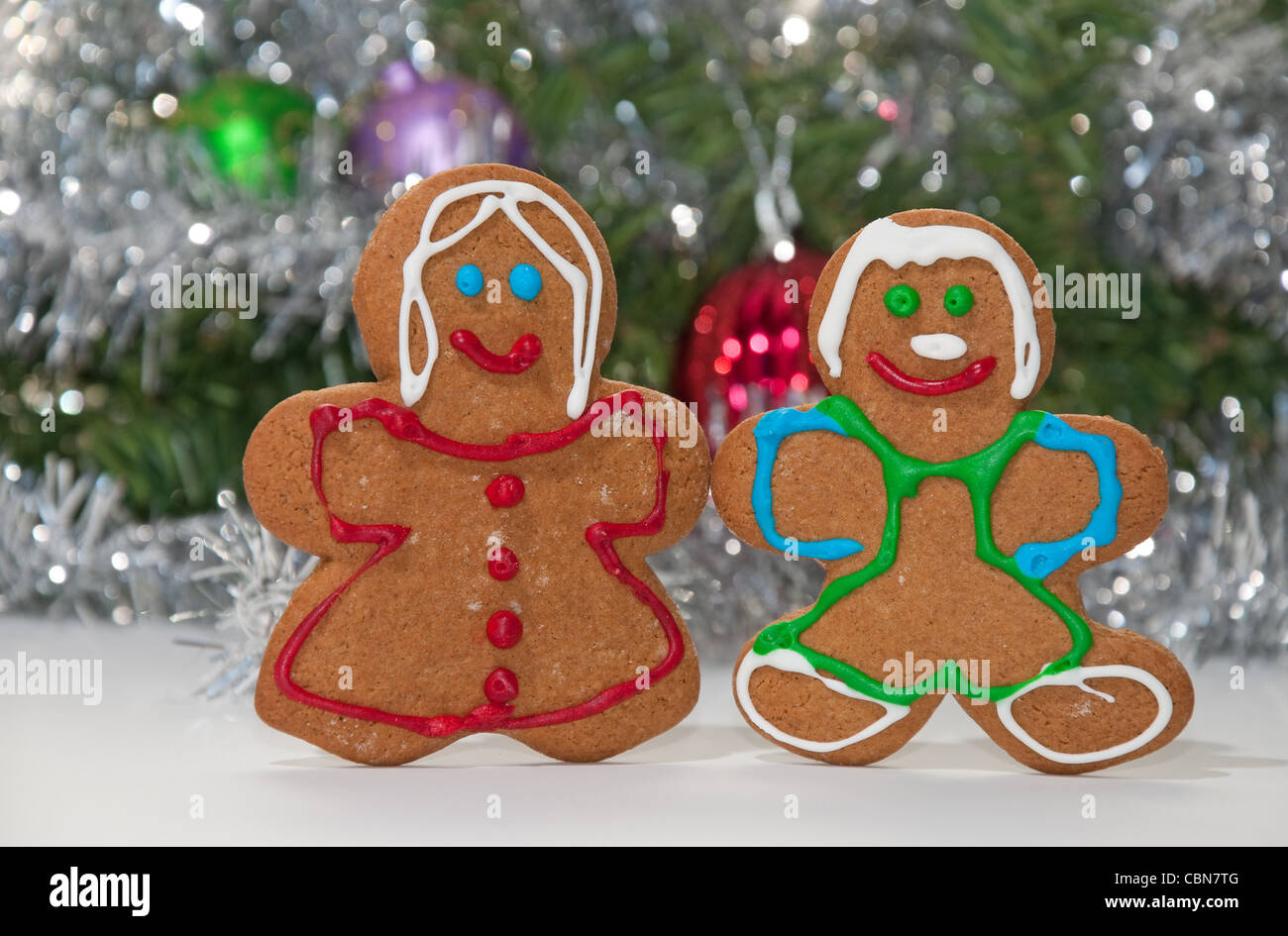 Gingerbread man and woman holding hands Stock Photo