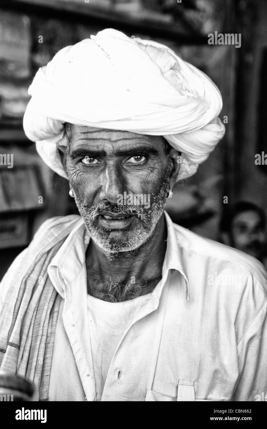 Traditional Hindu vendor man with white turban portrait in Jaipur Rajasthan India Stock Photo