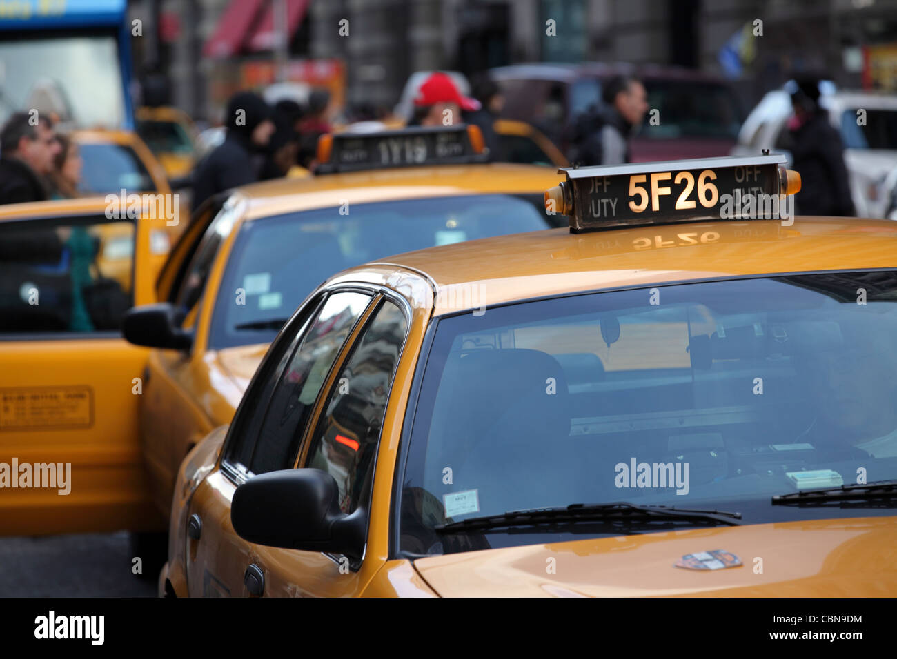 line of yellow taxi cabs in heavy traffic Manhattan, New York City, NYC, USA Stock Photo