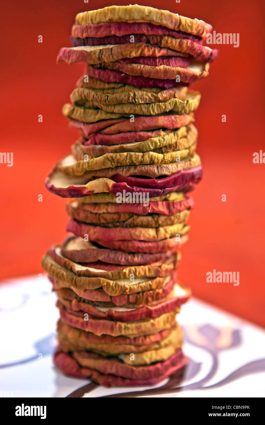 Apple chips dried apple rings, stacked to a tower Stock Photo