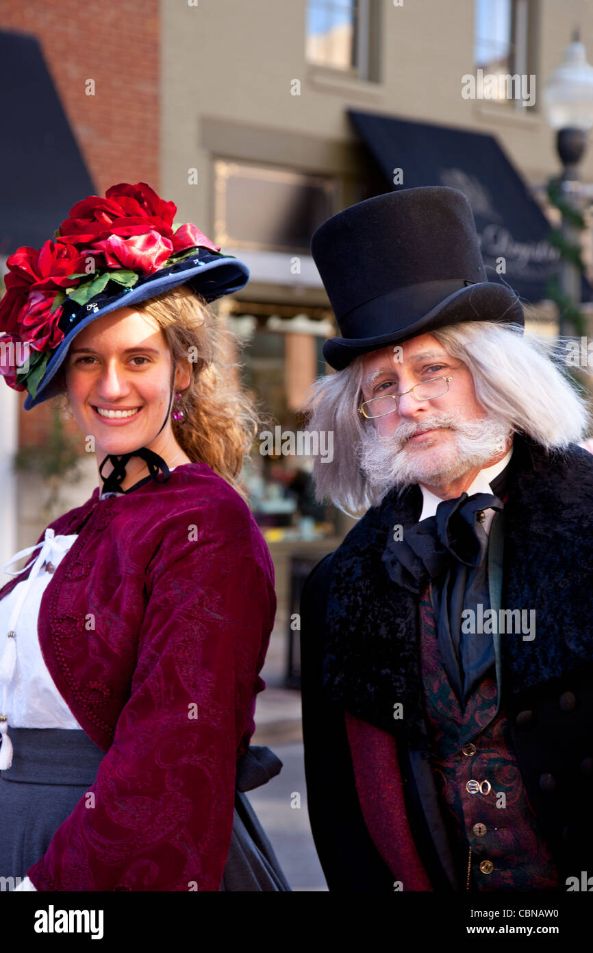 Scrooge and young woman - Charles Dickens characters during 'Dickens Christmas' Festival, Franklin Tennessee USA Stock Photo