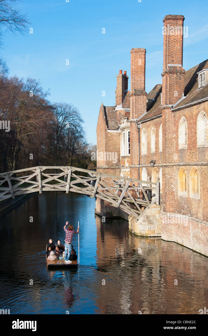 Punters go under the Mathematical bridge at Queens College Cambridge. UK Stock Photo