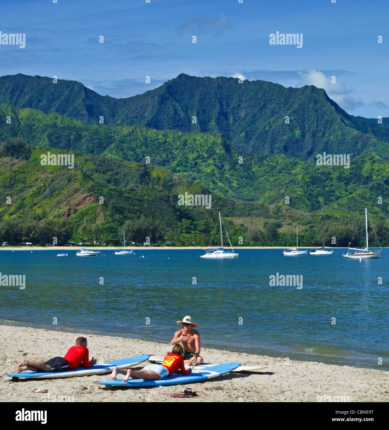 Surfing lesson at Hanalei Beach on Kauai Stock Photo Alamy