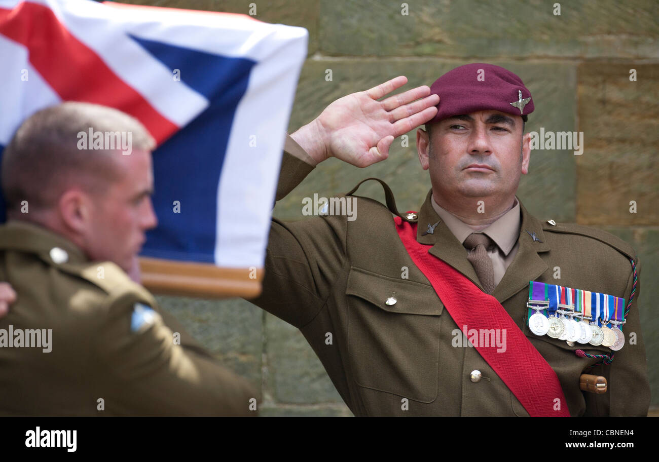 A Paratrooper salutes a fallen comrade killed in Afghanistan during the conflict. Picture by James Boardman. Stock Photo