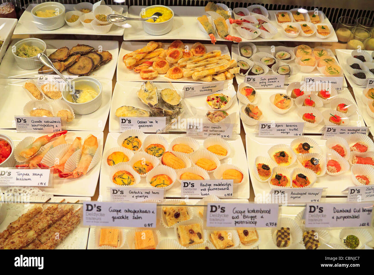 Display of savoury pastries in a window in Bruges, Belgium. Stock Photo