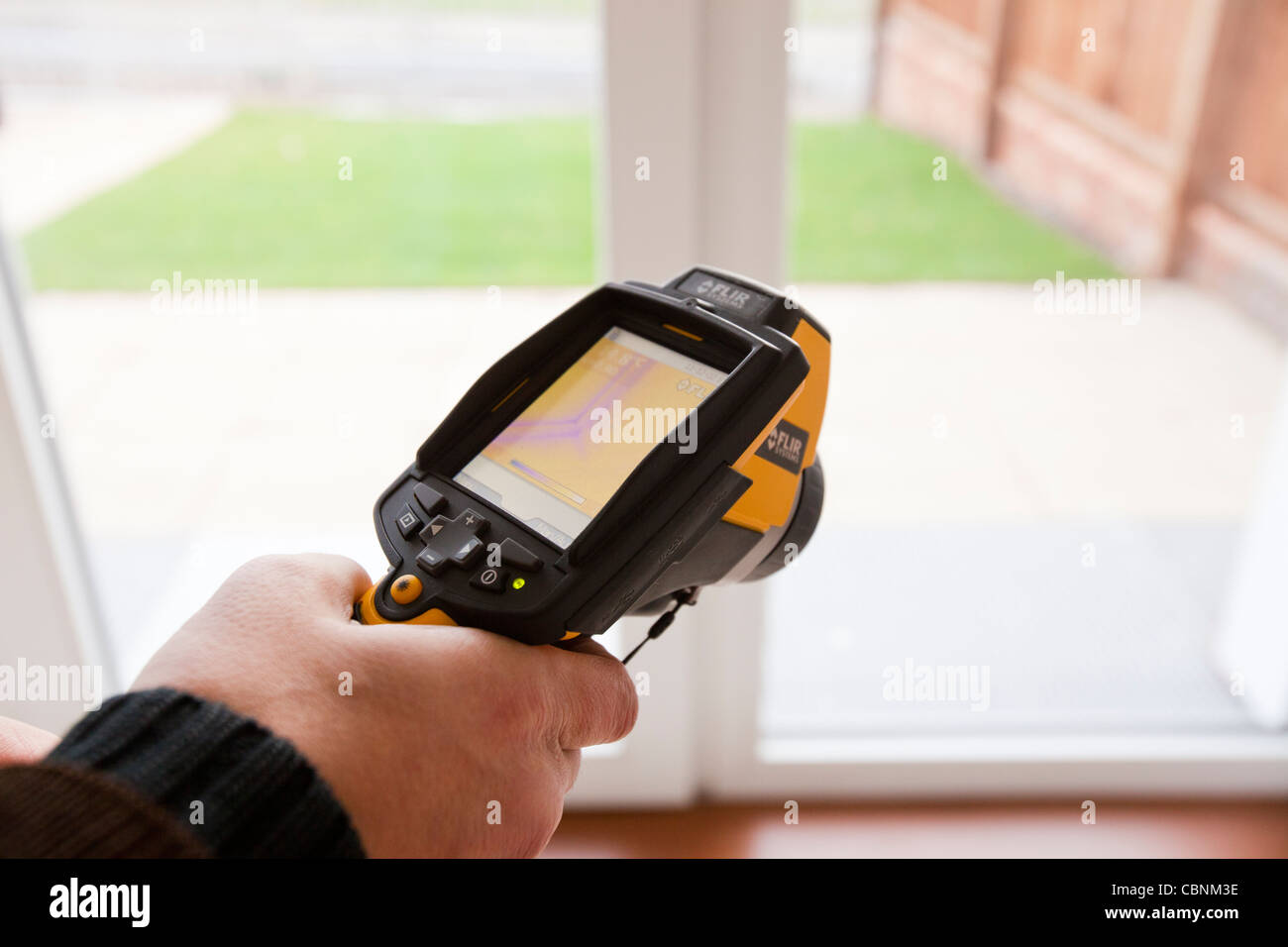 An architect uses a thermal imaging camera to test the thermal