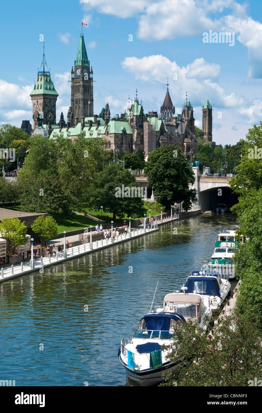 Yachts mooring on the Rideau Canal below the Parliament Centre Block in Ottawa Canada. Stock Photo