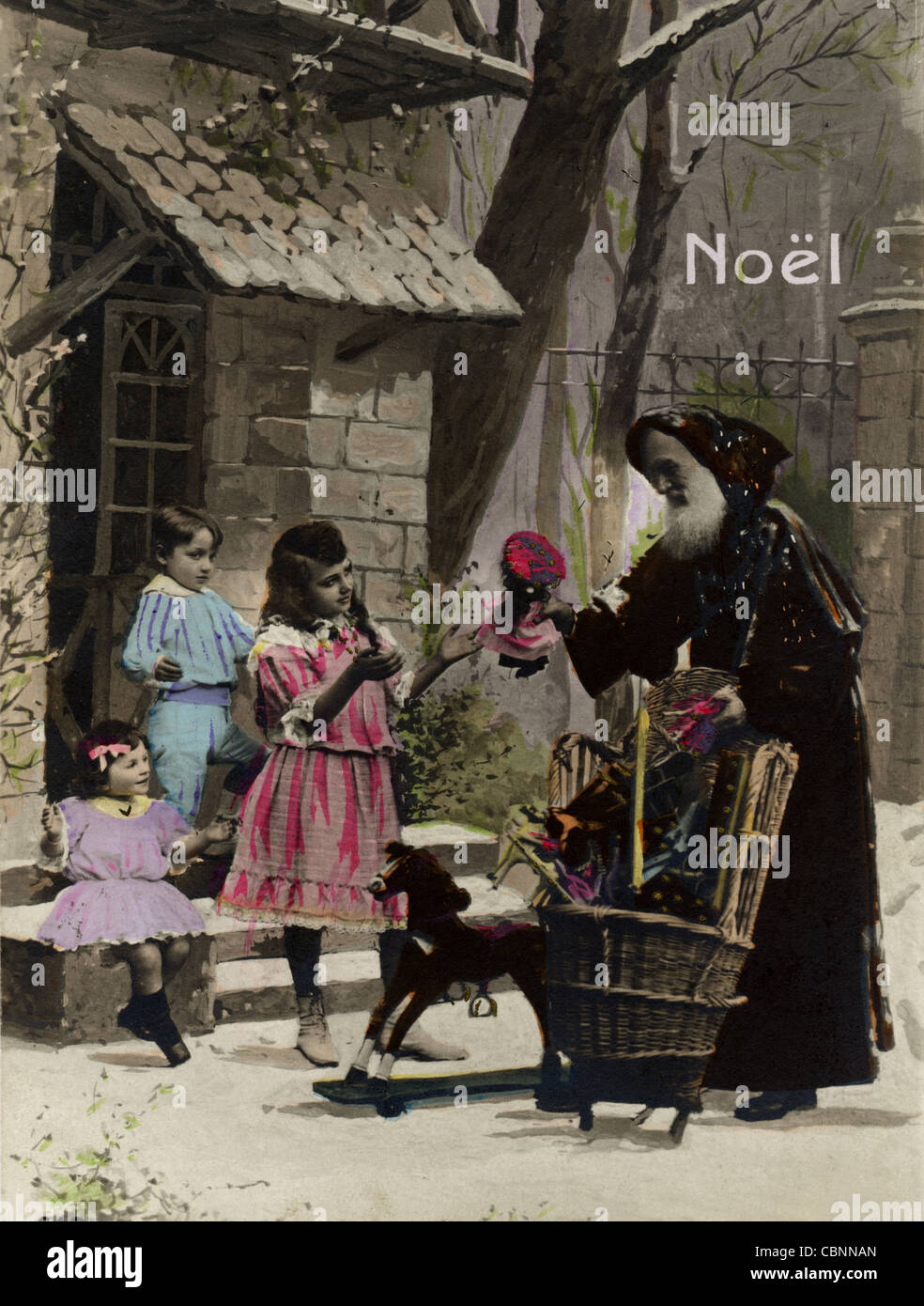Santa Claus Handing Out Presents to Three Children Stock Photo