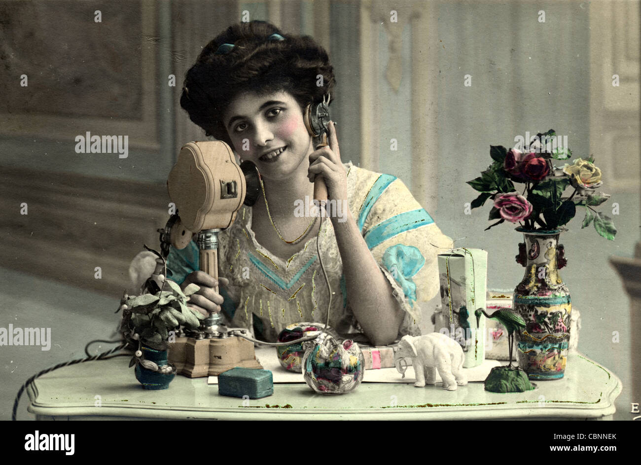 Elegant Woman Speaking on European Candlestick Telephone Stock Photo