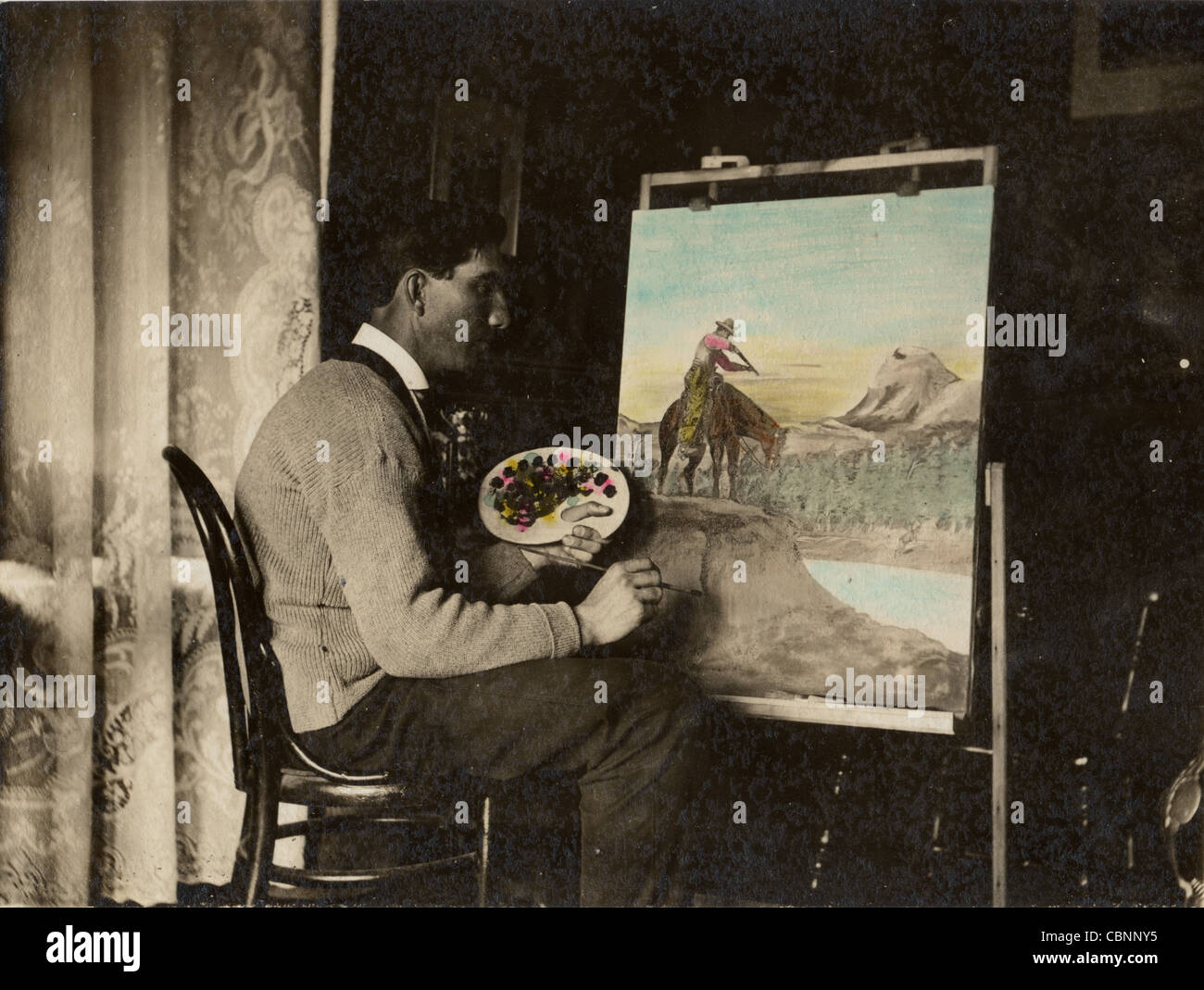 Amateur Artist Painting Cowboy Picture at Home Stock Photo