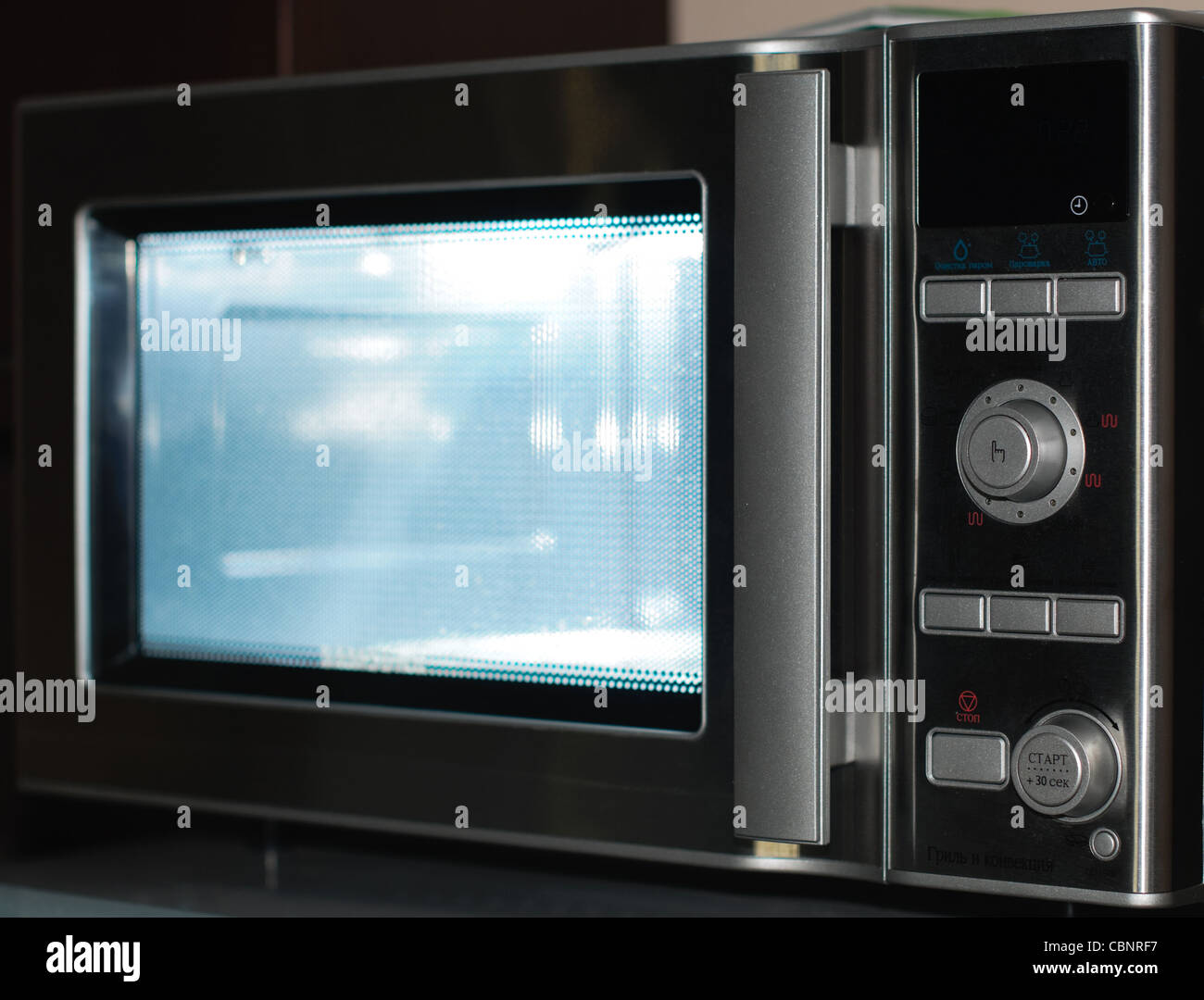 details of modern microwave oven in the kitchen Stock Photo