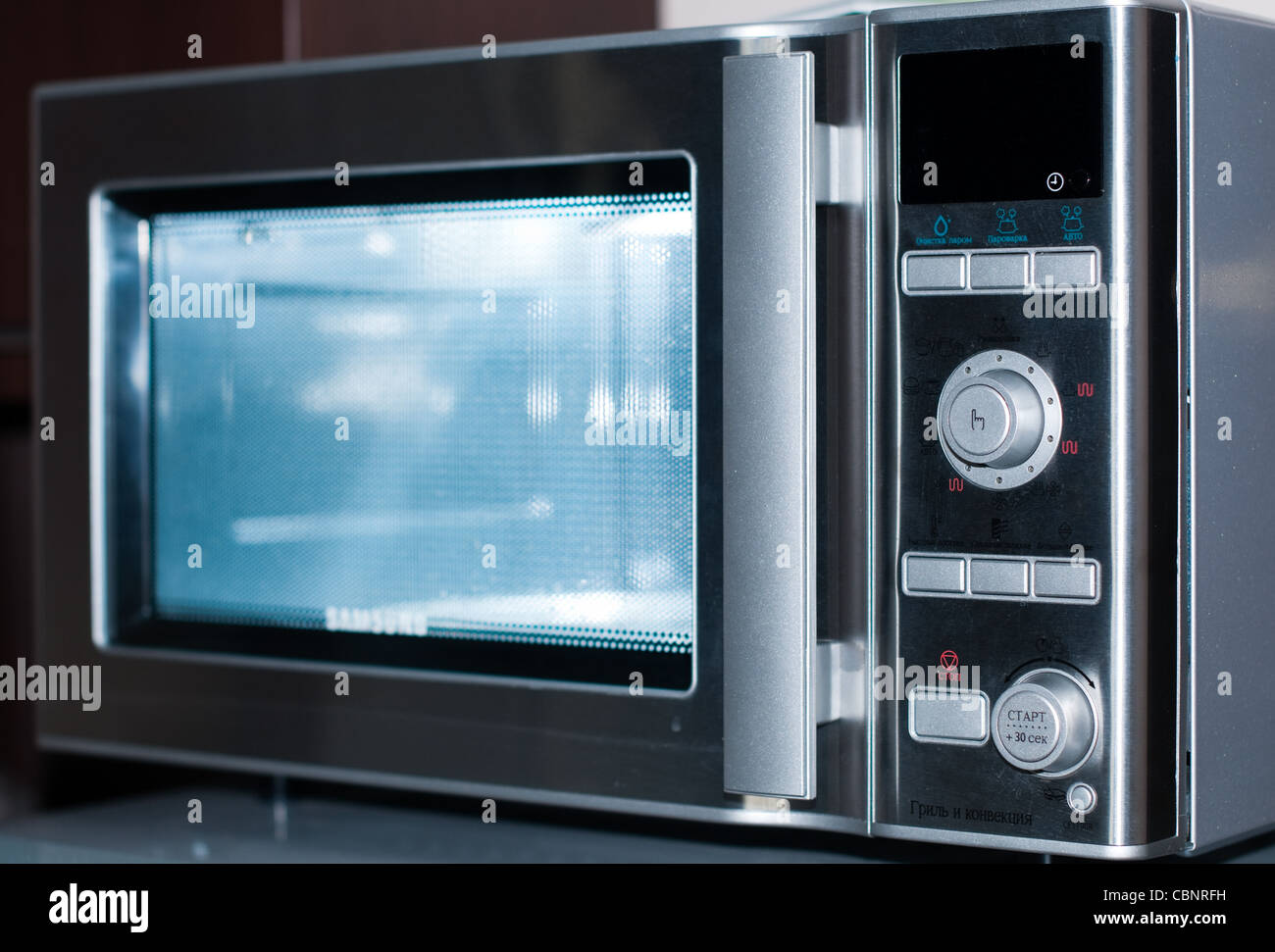 details of modern microwave oven in the kitchen Stock Photo