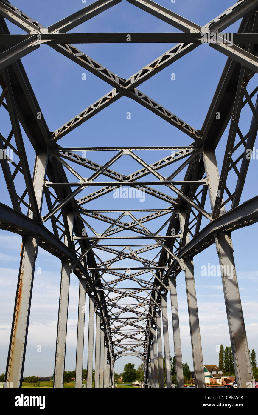 Old iron railway bridge with blue sky background Stock Photo - Alamy