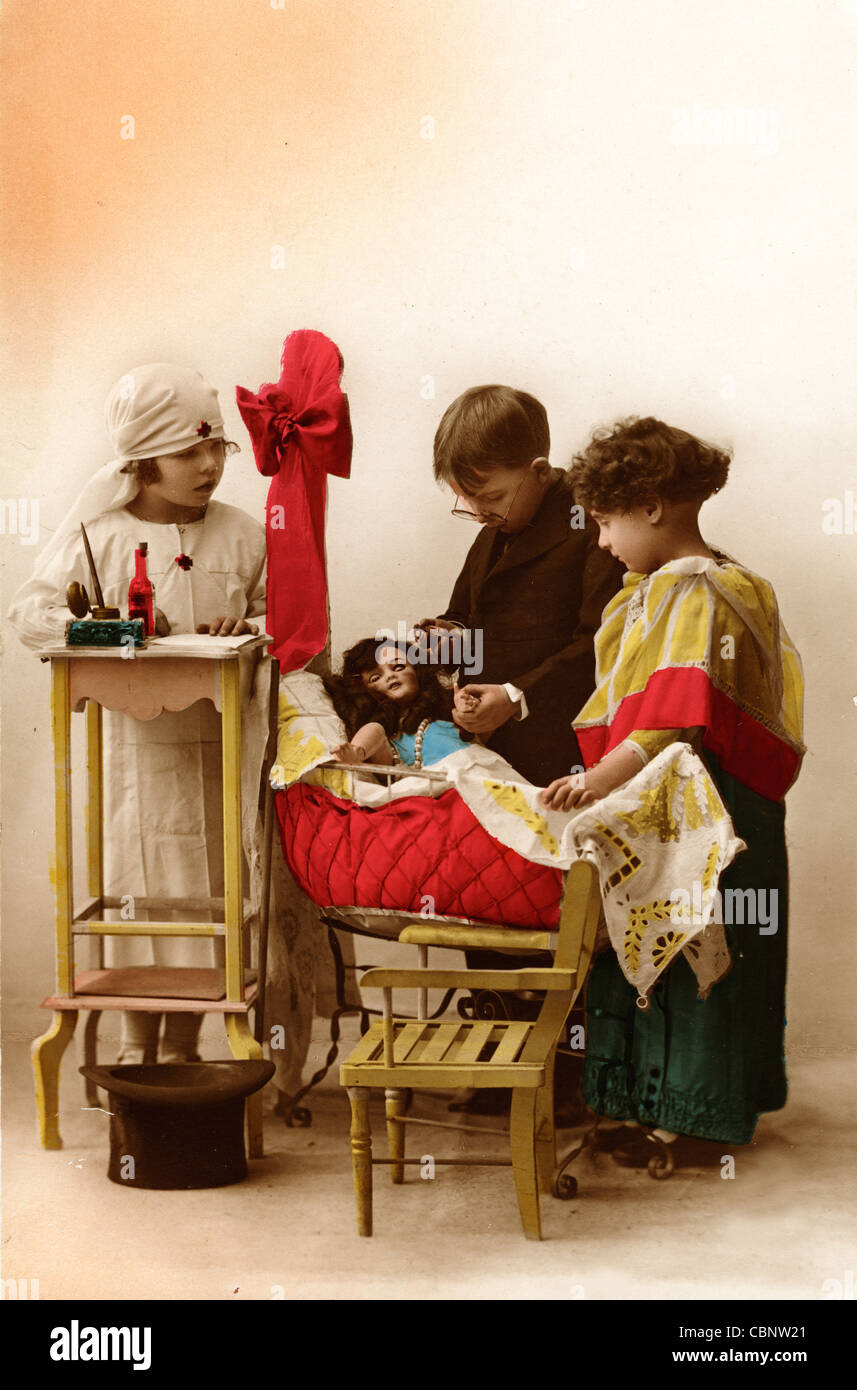 Child Medical Personnel Ministering to Sick Doll Patient Stock Photo