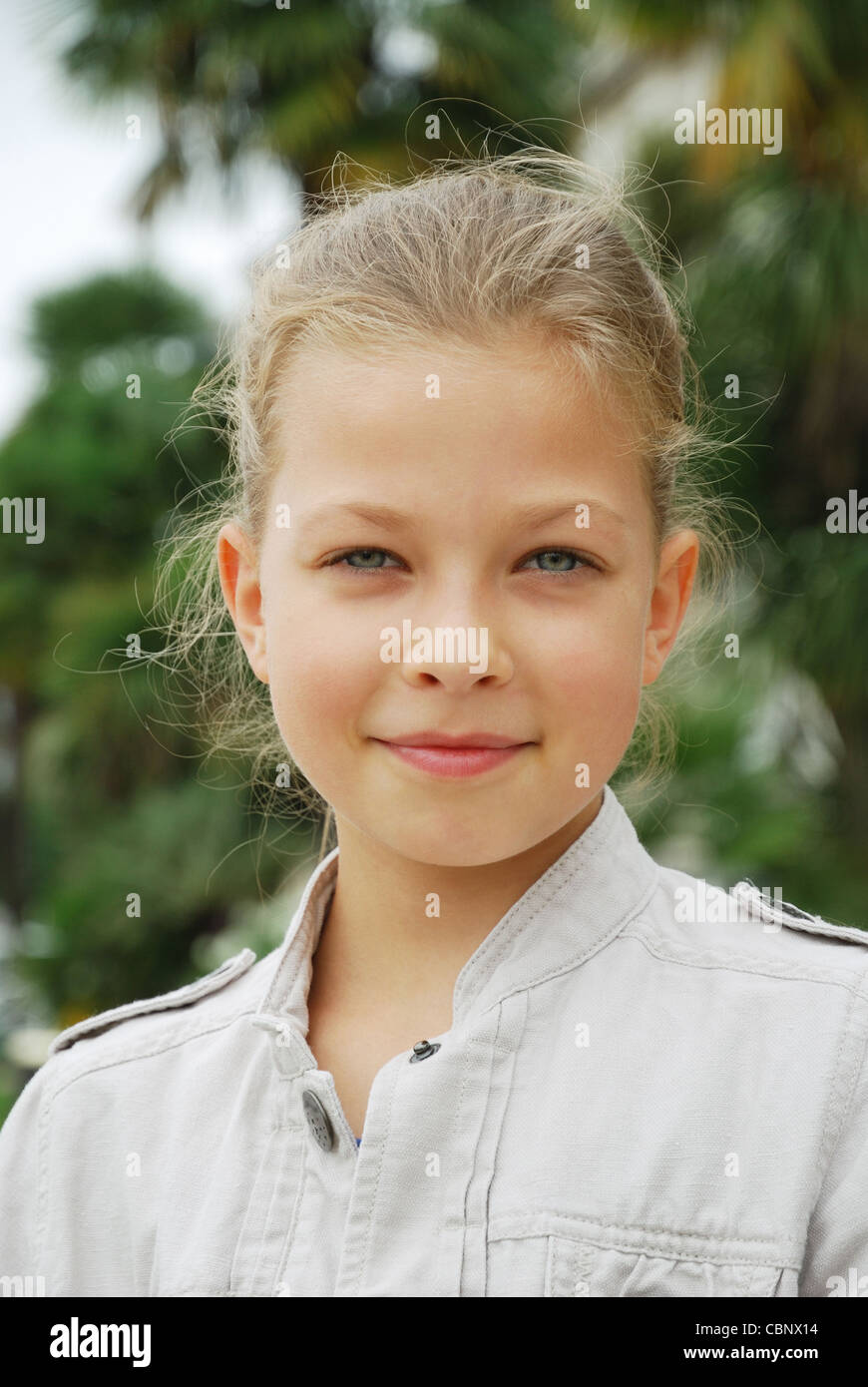 Portrait of cheerful preteen girl Stock Photo - Alamy
