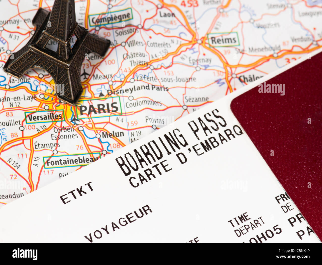 eiffel tower, compass and passport with boarding pass Stock Photo
