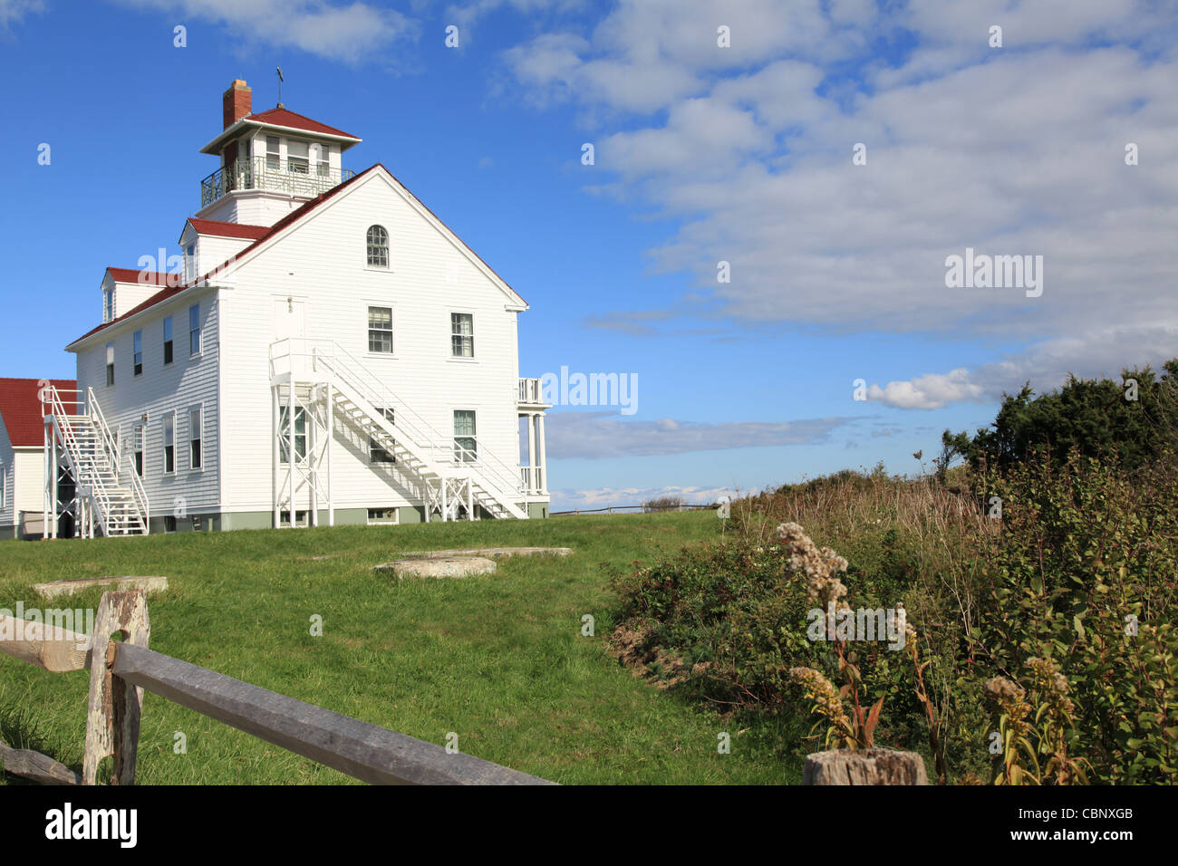 USA, Cape Cod, White lighthouse at the Beach Stock Photo