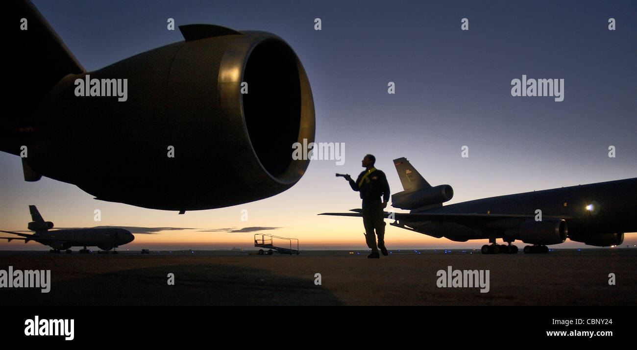 TRAVIS AIR FORCE BASE, Calif. -- Staff Sgt. Talbert Reese performs a walk-around inspection before an aerial refueling mission from here. He is a KC-10A Extender flight engineer from the 9th Aerial Refueling Squadron. Stock Photo