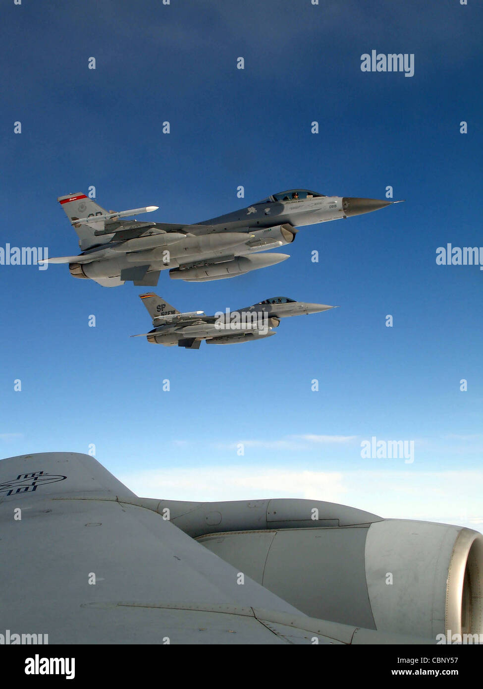 ZHUKOVSKY, Russia -- Two F-16 Fighting Falcons from Spangdahlem Air Base, Germany, await refueling from a KC-135 Stratotanker from Royal Air Force Mildenhall, England, en route to the Moscow International Aviation and Space Salon Aug. 14. About 100 servicemembers are participating in the air show Aug. 16 to 21. Stock Photo