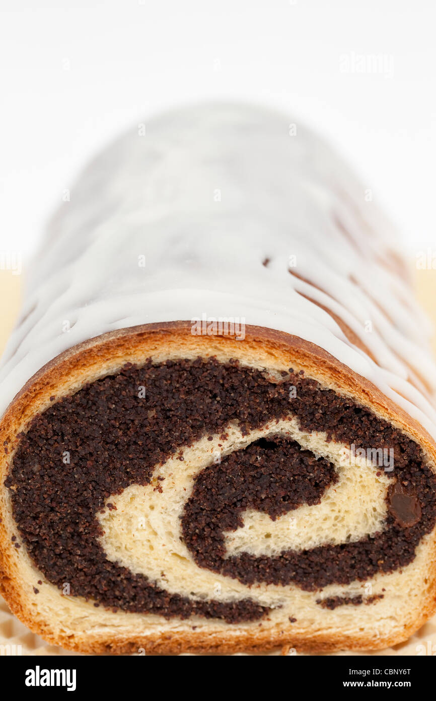 poppy-seed cake with sugar-icing on cake Stock Photo