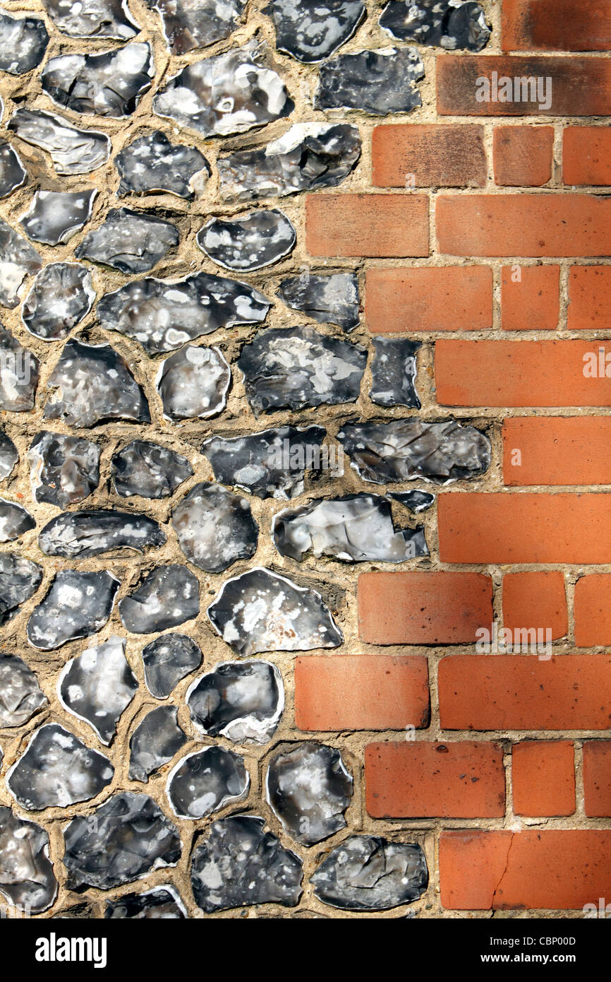 Flint and red brick wall of Saint Mary's Church, The Avenue, Worcester Park Surrey England UK Stock Photo