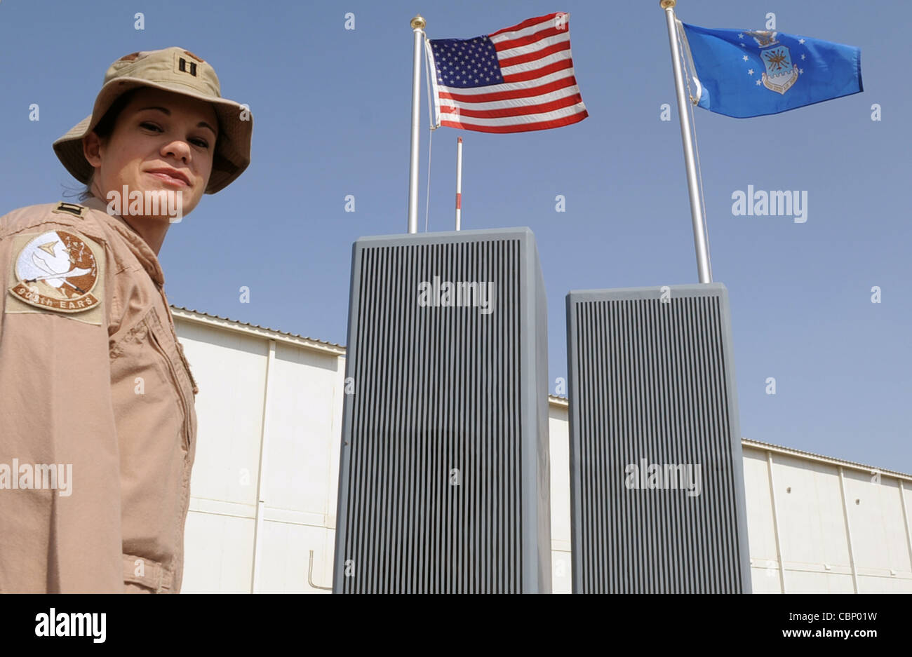 Capt. Hillary Wykes, a KC-10 Extender pilot with the 908th Expeditionary Air Refueling Squadron, stands by the 380th Air Expeditionary Wing's Sept. 11, 2001, memorial at an air base in Southwest Asia on Jan. 13, 2010. Captain Wykes is deployed from the 9th Air Refueling Squadron at Travis Air Force Base, Calif., and her hometown is Plano, Ill. Stock Photo