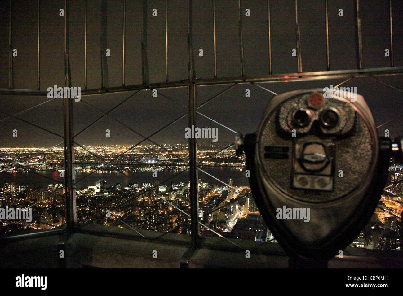 USA,NYC,View from Empire State Building at night with binocular Stock Photo