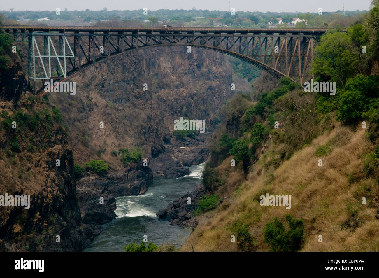 Africa Zambia-Bridge connecting Zimbabwe to Zambia. Near Victoria Falls with Zambezi River below. Stock Photo