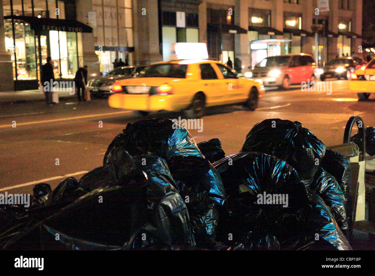 New York City Garbage at Night Stock Photo