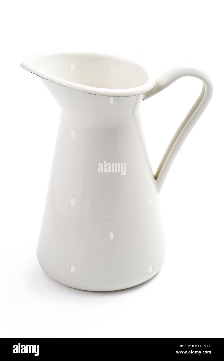 a white or cream metal enameled pouring jug Stock Photo