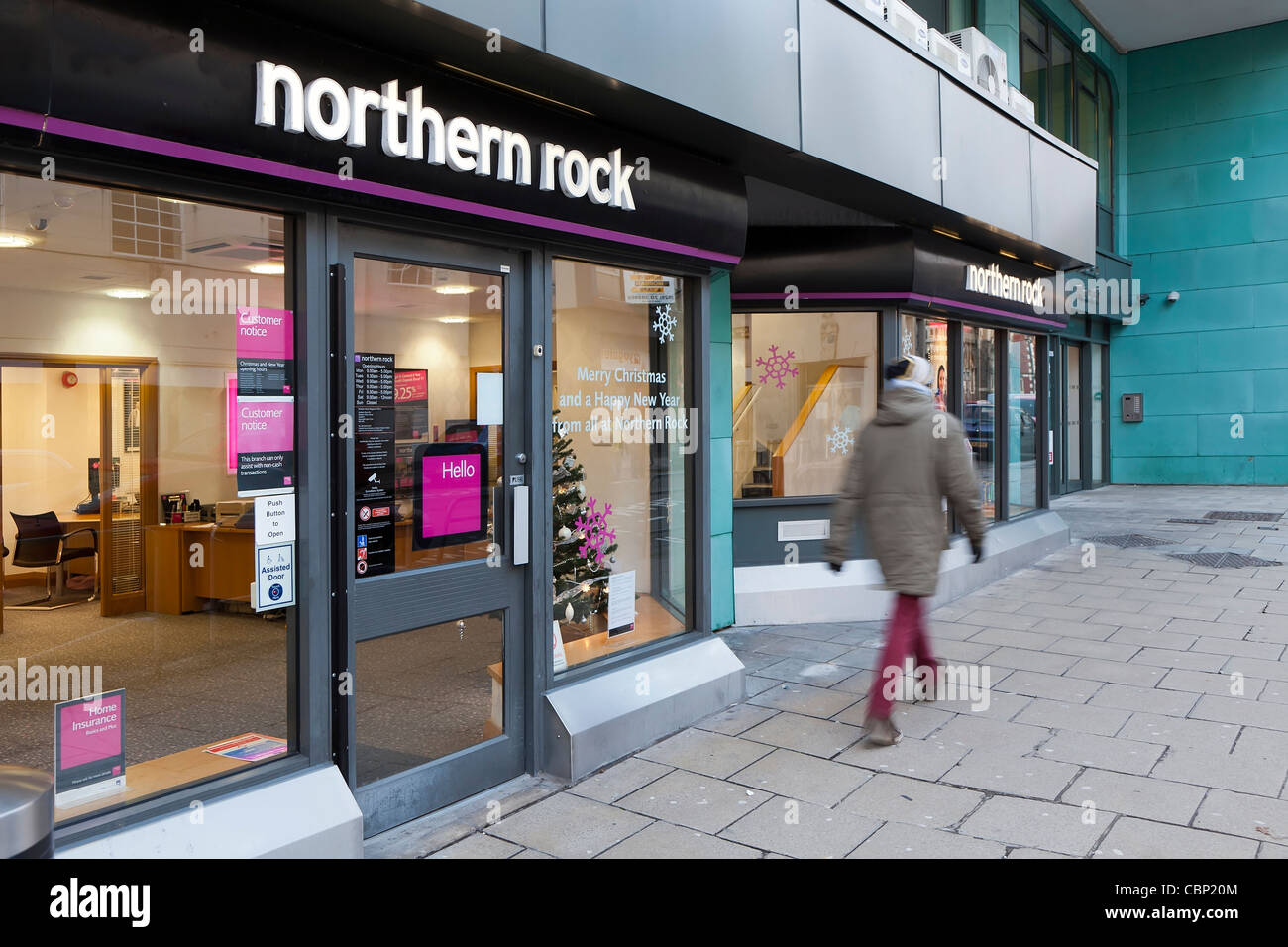 Person walking past Northern Rock bank Cardiff Wales UK Stock Photo