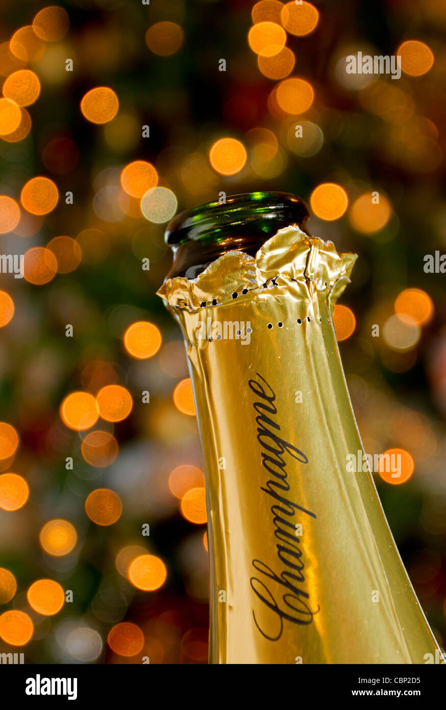 Champagne bottle on christmas sparkly background Stock Photo
