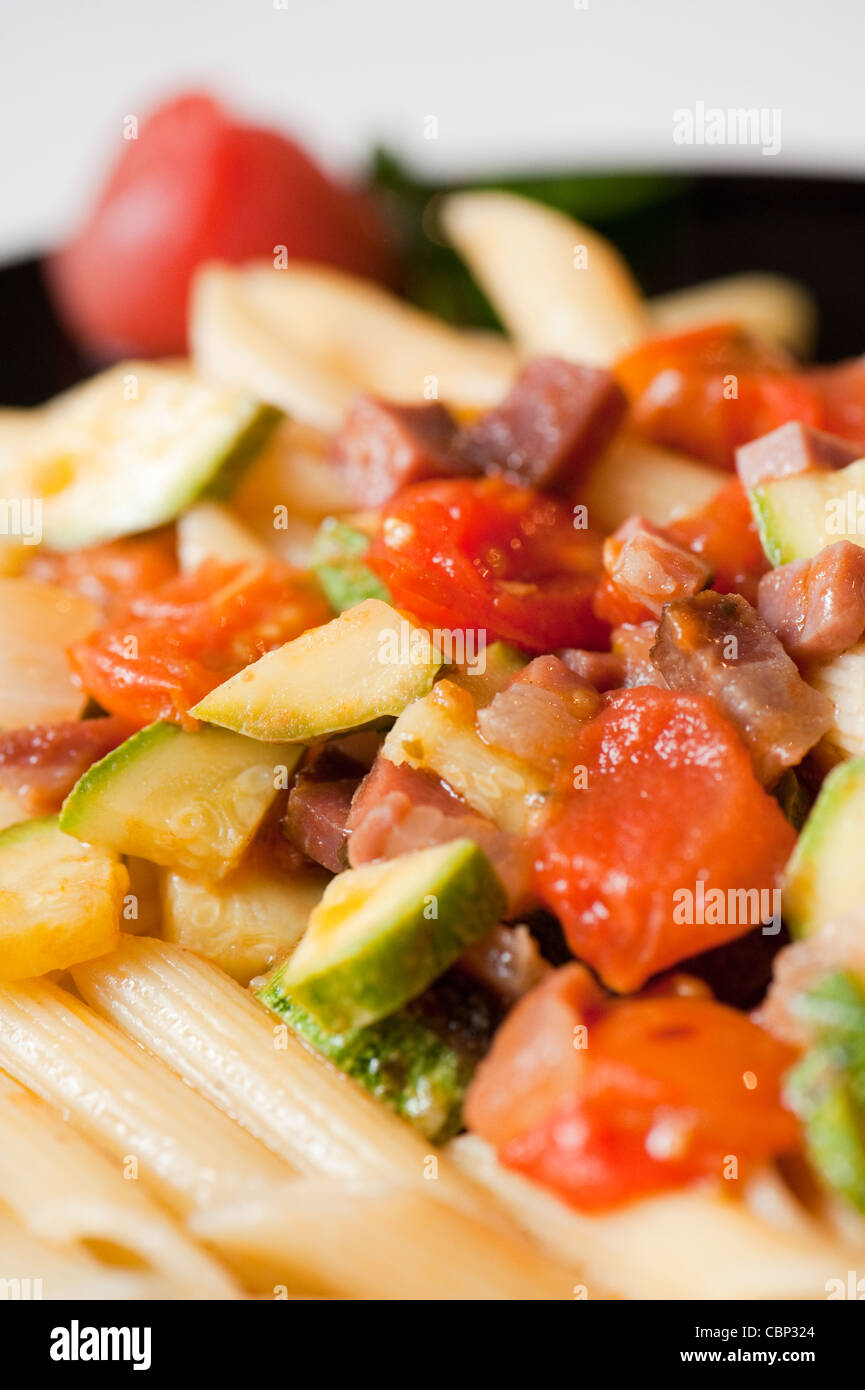 pasta with tomatoes, courgettes and ham in the italian restaurant "Il