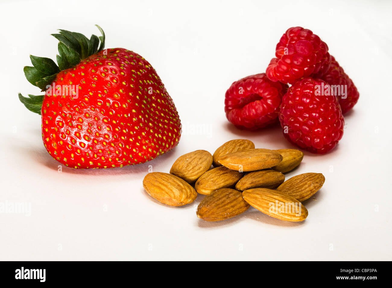 Strawberry, Raspberries and almonds on the white background Stock Photo ...