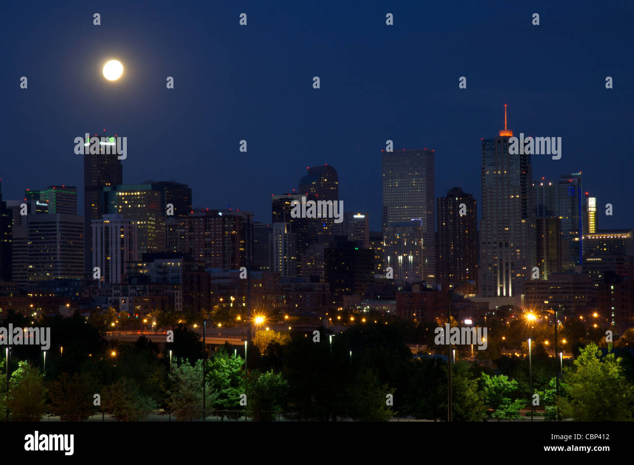 Downtown Denver skyline at dusk with moon. Stock Photo