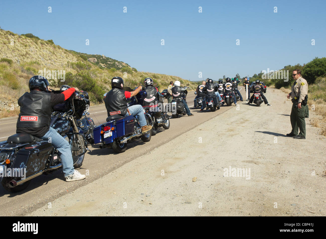 Members of the San Diego sheriff's department detain a group of Hell's Angels outside of Alpine, CA. Stock Photo