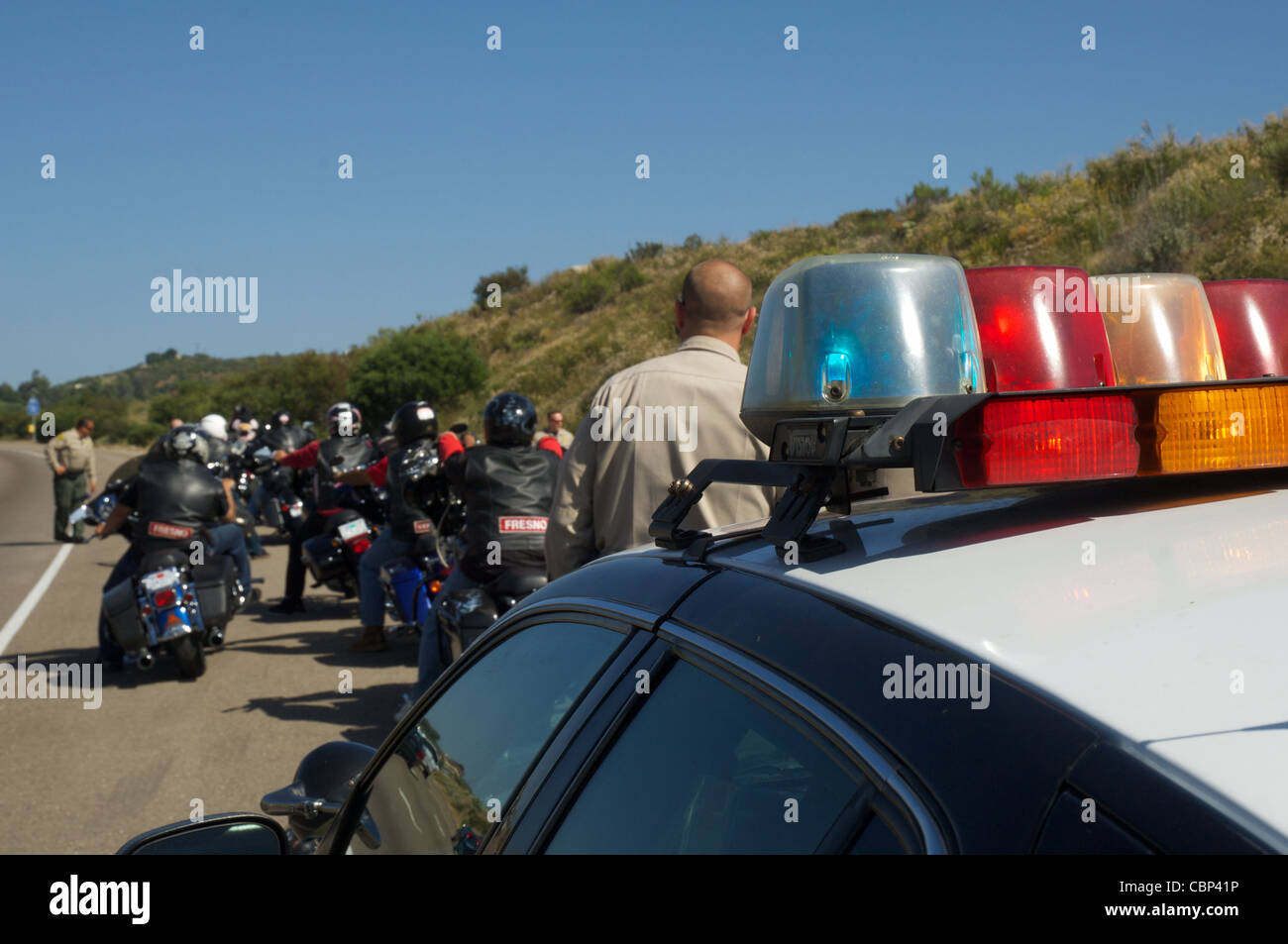 Members of the San Diego sheriff's department stop a group of Hell's Angels outside of Alpine, CA. Stock Photo