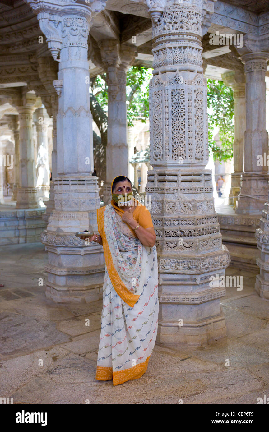 Jain pilgrim with traditional mask at The Ranakpur Jain Temple at