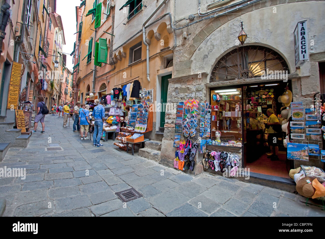 Shops and restaurants at narrow alley of fishing village Porto Venere