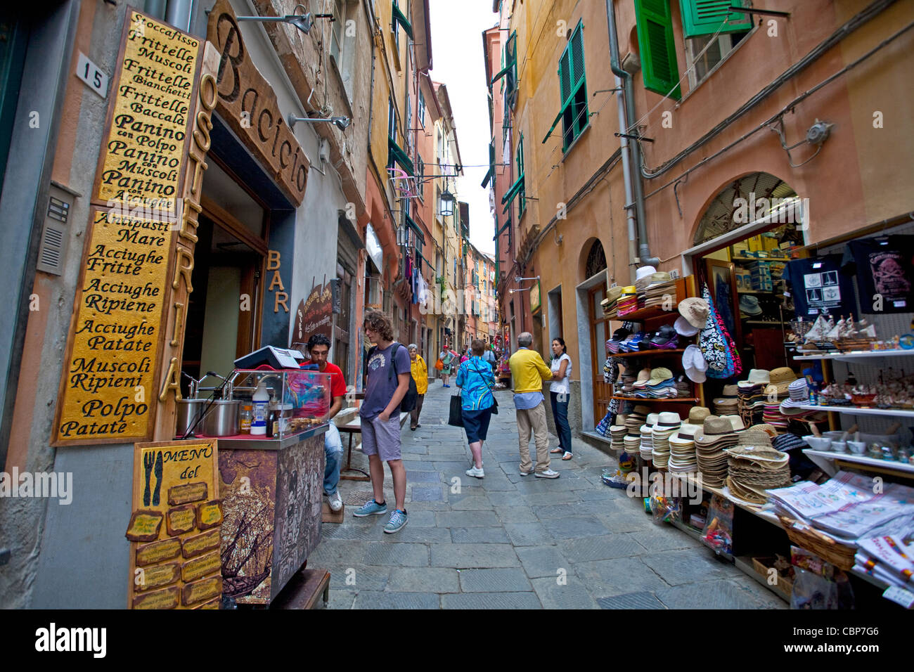 Shops and restaurants at narrow alley of fishing village Porto Venere